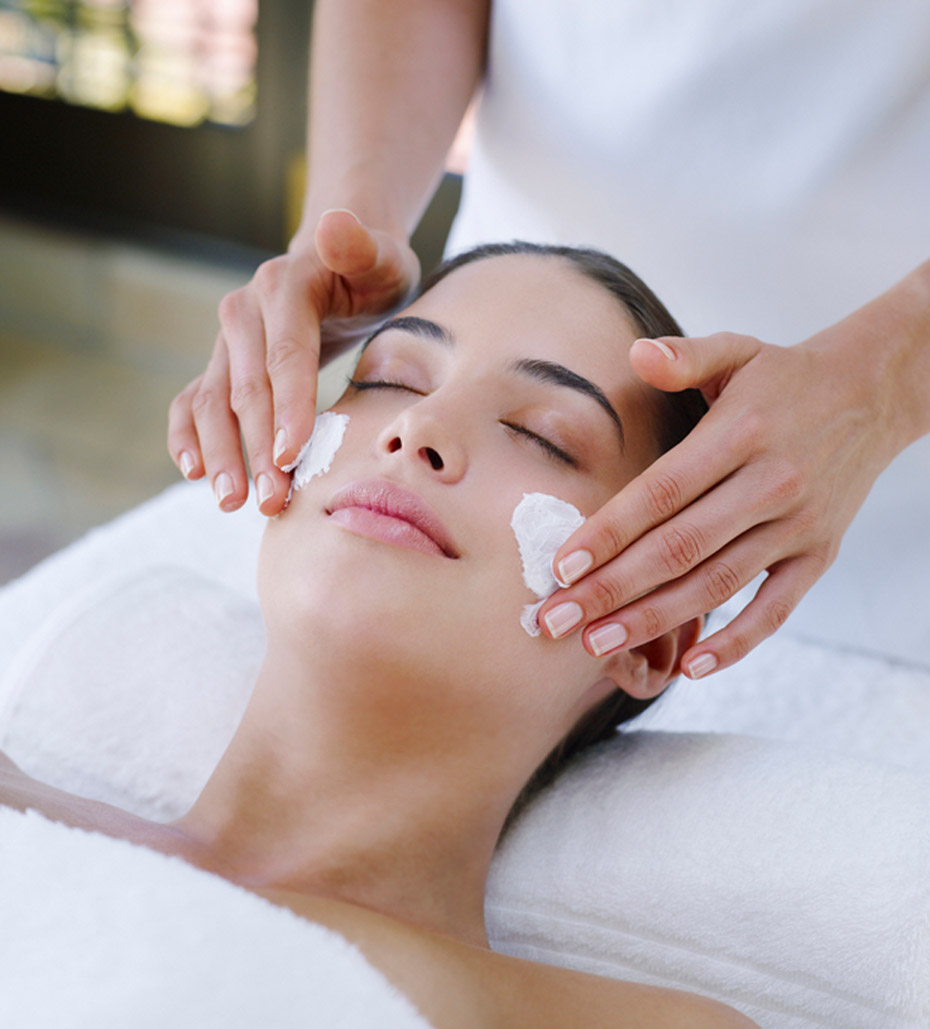 esthetician-performing-a-basic-facial-to-female-client