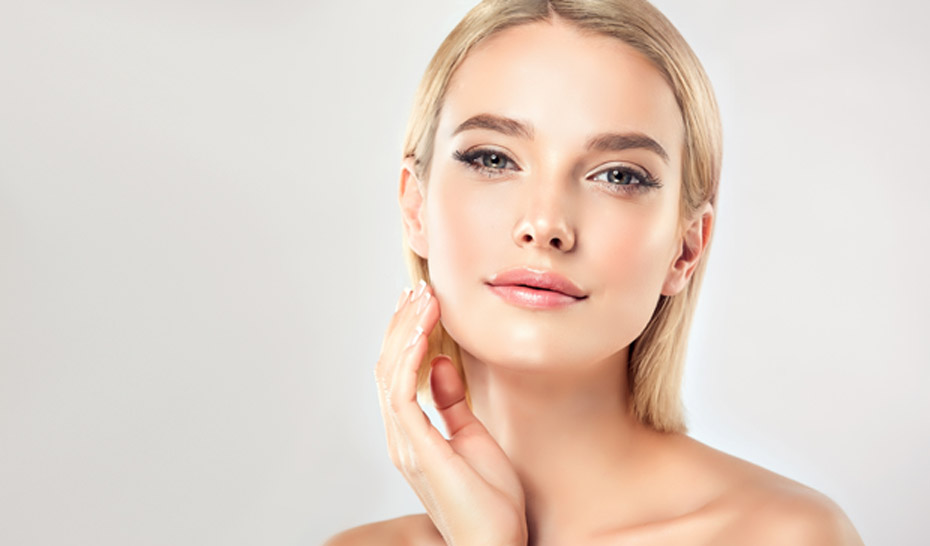 woman-touching-her-jawline-after-treatment-with-juvederm-vollure