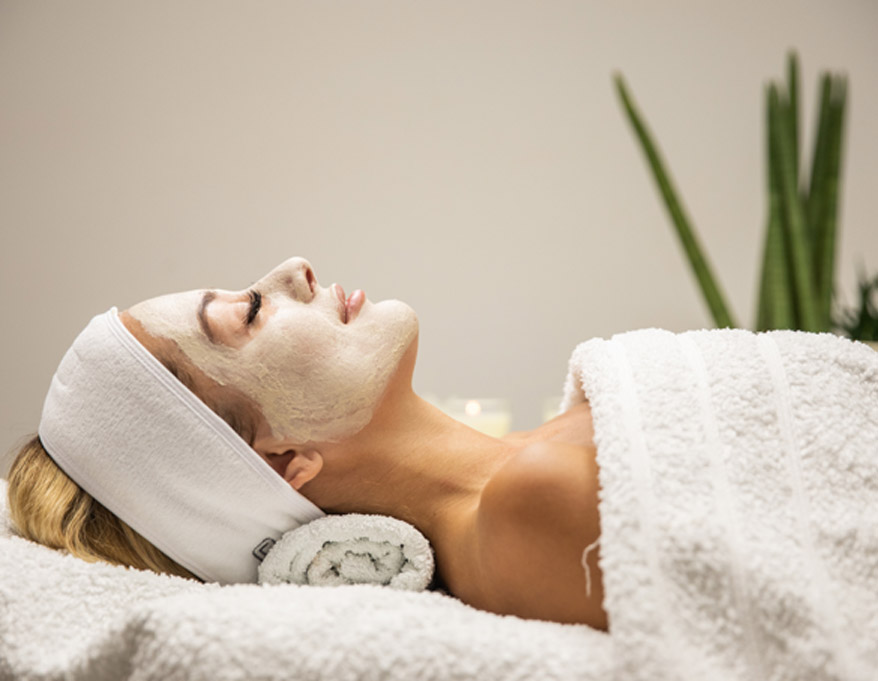 woman-with-a-mask-during-prescription-system-facial-at-a-spa